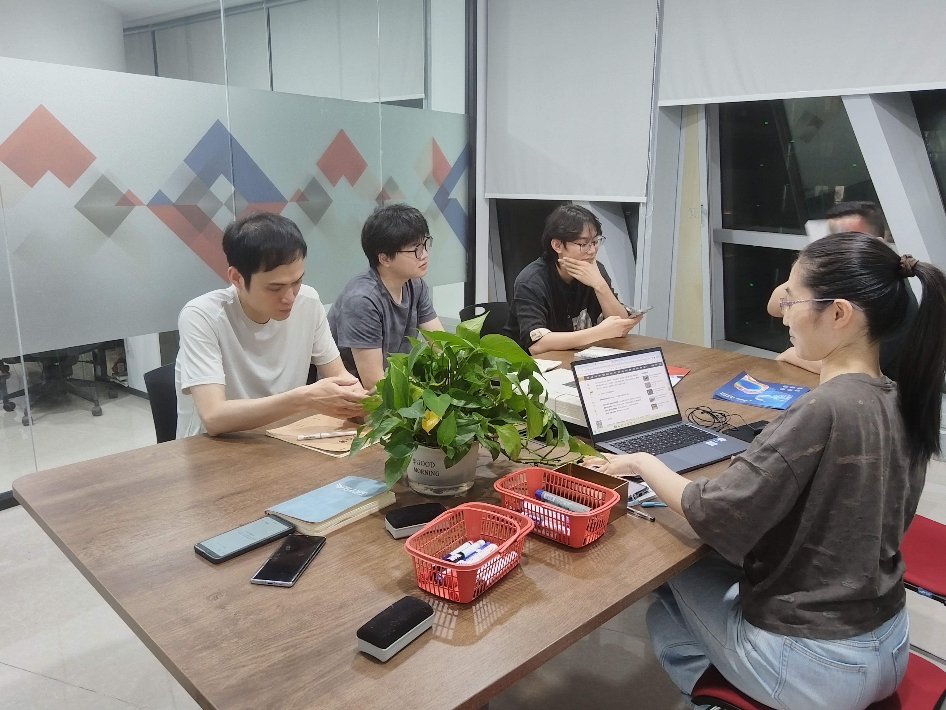 Our team · A meeting in progress